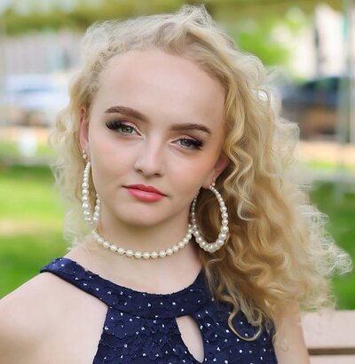 Creative Atlanta senior portrait with car and city backdrop