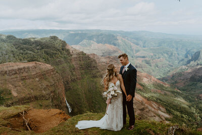 bride and groom holding eachother