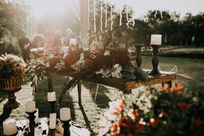 Boho and luxury wedding decor, a moody table with flower arrangement and candles