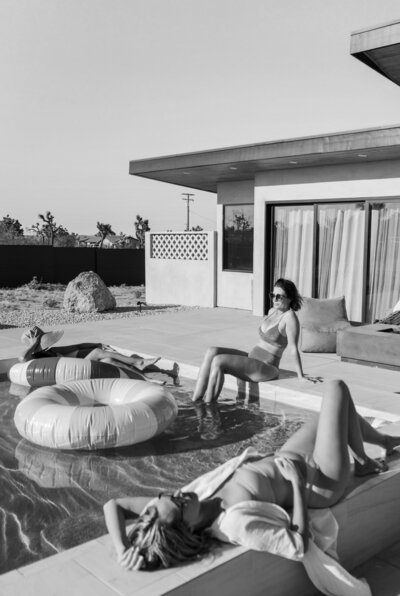 women sitting poolside at vacation rental