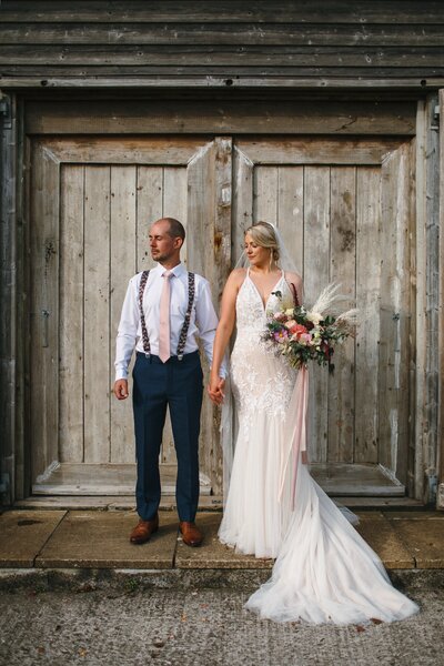 Couple pose for wedding photo at Camel Studios