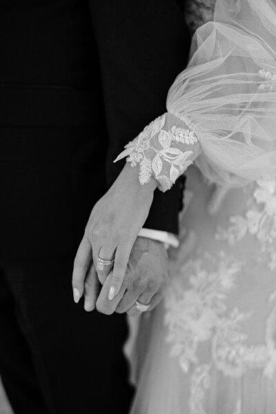 bride and groom holding hands