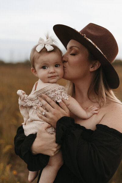 montana wedding photographer holding baby