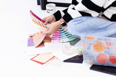 Wedding invitation designer in Phoenix reviewing color samples