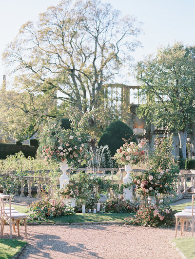 outdoor garden wedding ceremony at luxury castle venue