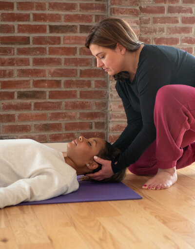 two women in yin assist