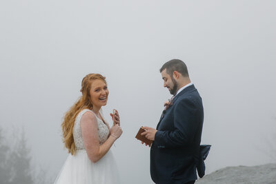 Couple reading vows during winter elopement on the Blue Ridge Parkway