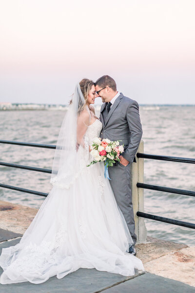Bride and groom share a moment on the water in Charleston , South Carolina.