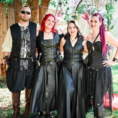 Renaissance pirate themed wedding party in leather corsets and fantasy attire, styled in Las Vegas.