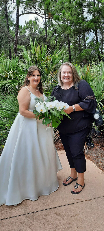 Tracy and a St Augustine bride bonding over a bouquet of florals