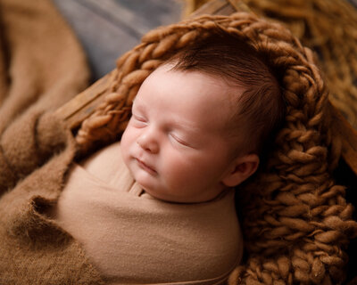 Wrapped newborn in browns
