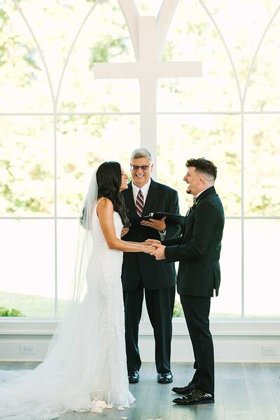 charlotte wedding photographers capture ring exchange at wedding ceremony