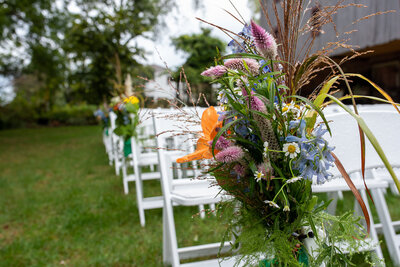 Chairs assembled for a wedding ceremony outdoors