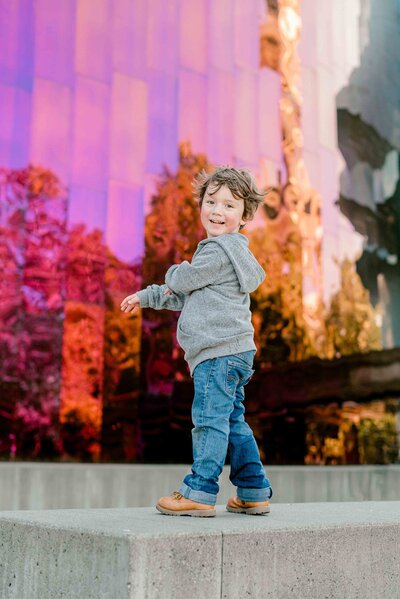 Toddler boy posing in front of Mopop seattle