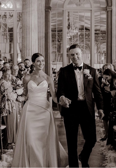 Bride and groom walk up memorial steps at their DC wedding