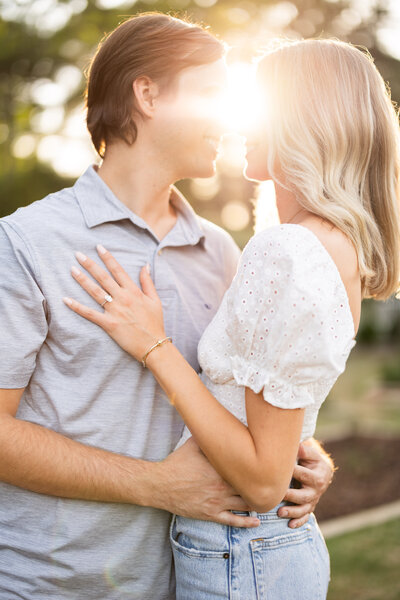 Couple posing during outdoor engagement session in Birmingham