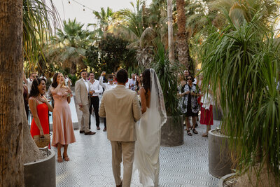 bride and groom enter their cocktail party