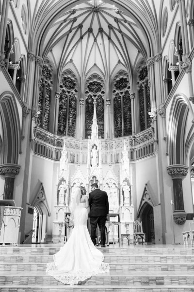 bride and groom at the altar of church st. louis mo wedding photographer