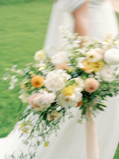 Blurry image of a bride's bouquet