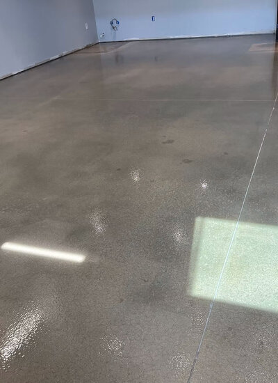 Polished concrete floors in Texas, featuring a sleek and durable finish ideal for both residential and commercial spaces, demonstrating high-quality craftsmanship.