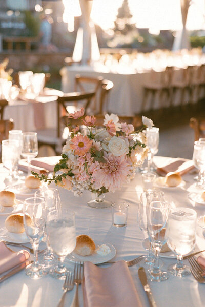 Bright floral centerpieces mixed with colorful fruit at Glen Foerd Estate in Philadelphia, PA