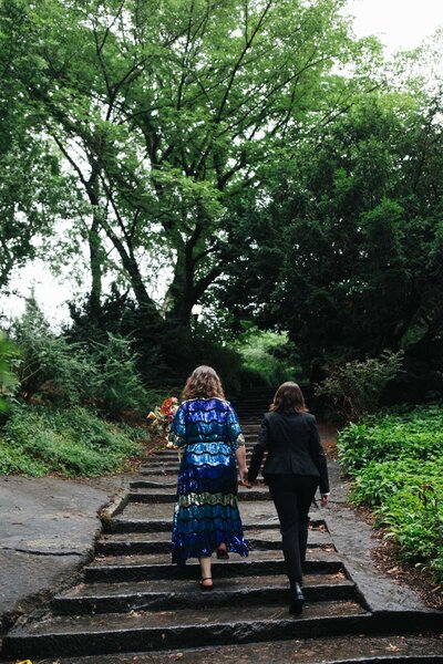 summer central park elopement couple walking up shakespeare garden steps