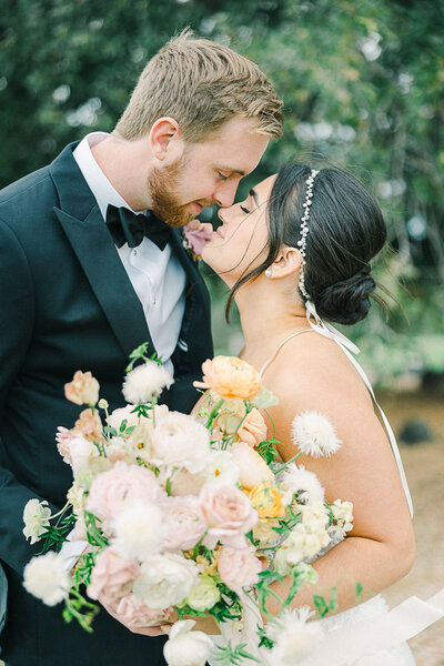 Elegant wedding celebration on a picturesque golf course in El Dorado Hills, CA, with the bride and groom surrounded by rolling hills and golden sunset light.