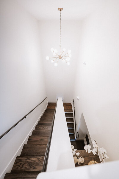 Elegant stairs leading to the honeymoon suite with unique light