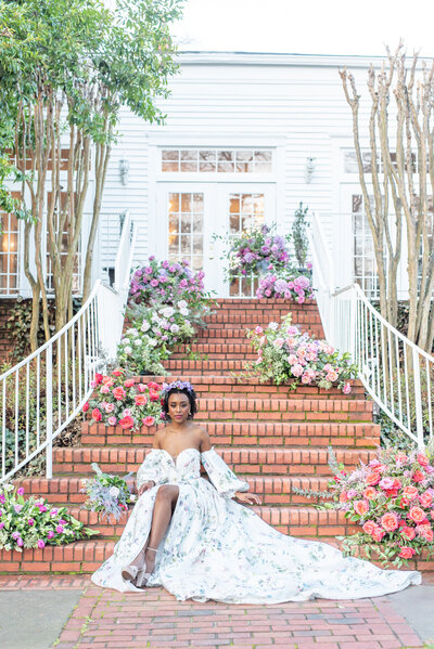 bride on staircase with flowers
