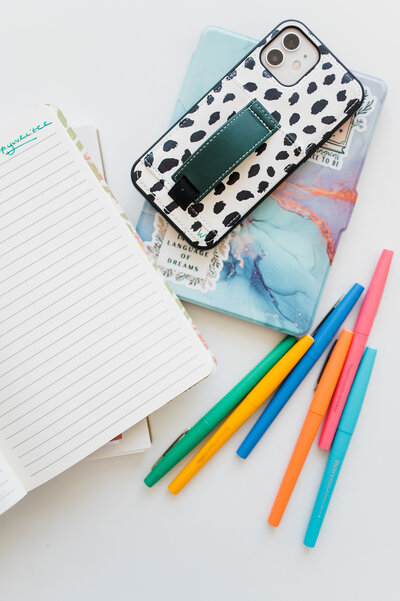 A stack of copywriting supplies on a desk