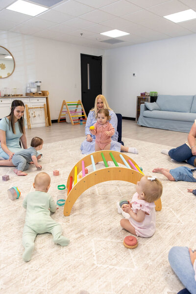 Group of women having a play date with their babies
