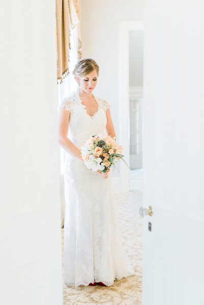 bride poses in the doorway in waterloo