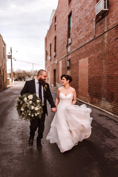 Bride and groom walk up memorial steps at their DC wedding
