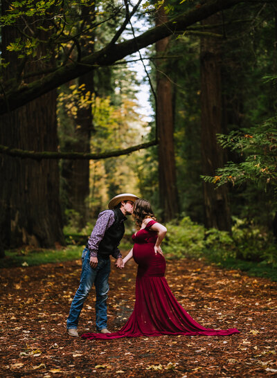 A maternity couple poses in the Humboldt Redwoods, while celebrating their impending birth.