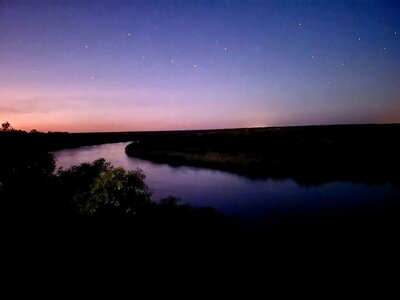 Purple at pink starlight on the Kavango river