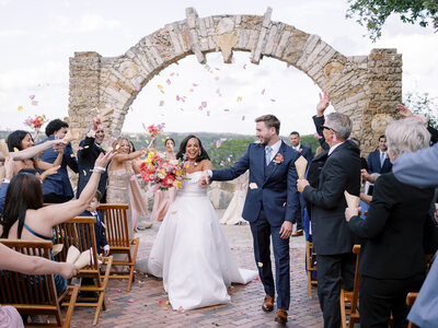 Bride and groom exiting ceremony at wedding planned by Bianca Nichole and Co