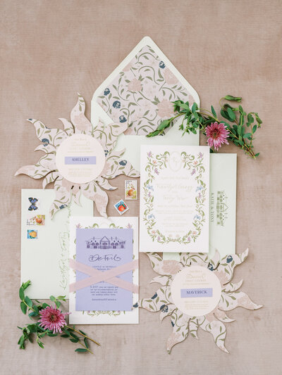 Floral invitations with envelopes, florals, stamps and paper designs by life in letters representing full service design and calligraphy by Life in Letters.