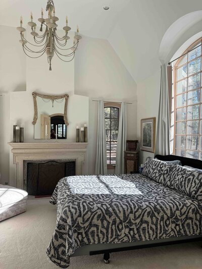 Ground view of a gorgeous stone chateau in a forest. 