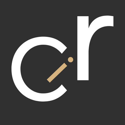 The logo for Crunch-IT-Creative featuring large, bold, uppercase letters "C" and "C" with "IT" written in smaller, red letters inside the first "C". The design is outlined in white with a small red dot after the second "C,"