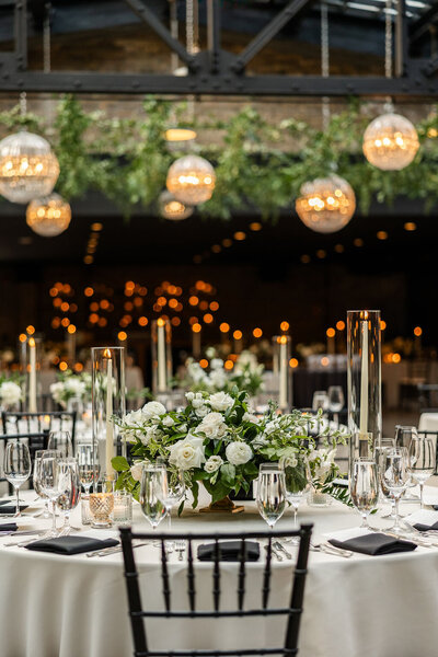 reception table layout with white florals at Revel Row wedding in Chicago, Illinois