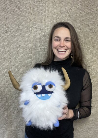 Natalie holding artistic plush toy