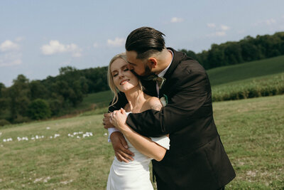 A photo at sunset showing a couple in a warm embrace, symbolizing intimacy and togetherness.