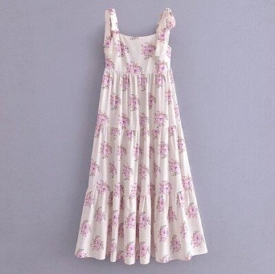 Cream coloured spring dress with purple flowers and adjustable tie straps