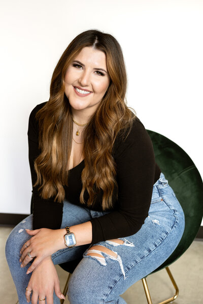 Headshot of woman hairstylist in her salon
