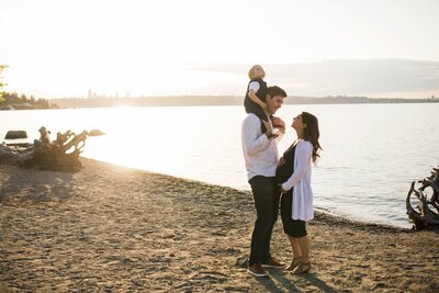Luther Burbank Park, Mercer Island, Maternity Portrait of husband and wife with toddler son at sunset