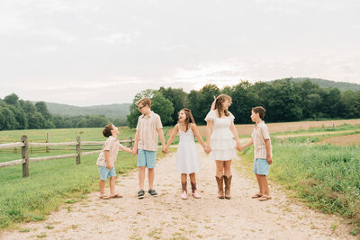 Extended family laughing in field  | Sharon Leger Photography