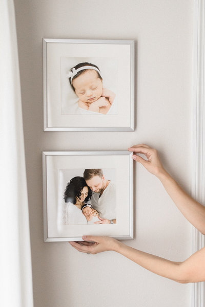 Square frames of art hanging on the wall
