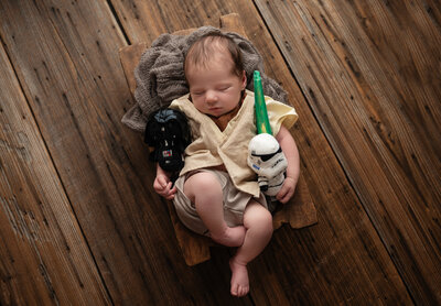 newborn with star wars props