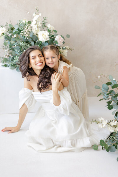 High-end motherhood session setup in Tampa: neutral-toned studio with natural textures