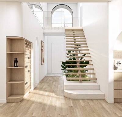 Floating staircase in the Solis home leading to an upper level with a large arched window and light-filled foyer.
